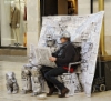 escaping_winter_9th_day_malaga_calle_marques_de_larios_a_living_statue_of_newspapers.
