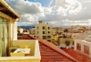 crete_chania._balcony_overlooking_the_sunny_roofs_of_chania.
