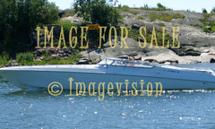 for sale white speedboat in front of rock island