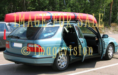 for sale station wagon car with canoe on roof