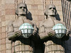 for sale serious stone men holding lamps