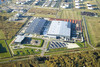 Hitachi Construction Machinery Europe (HCME) avasi vuonna 2002 Amsterdamin tehtaan, mistä valmistuu tela- ja pyöräalustaisia koneita Euroopan markkinoiden tarpeisiin. Tehdasalue levittäytyy 180 000 m2 tontille ja tuotantotilojen ala on 48 000 m2.
