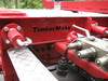 TimberMaxx maaliviimeistelyllä ja hydtauliikkasylinterijarruisilla nosturitupeilla.